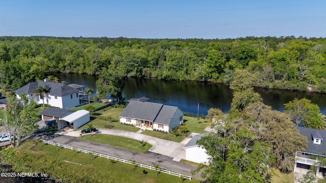 bird's eye view featuring a wooded view and a water view