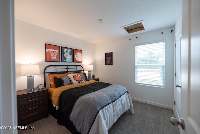 carpeted bedroom with baseboards and attic access