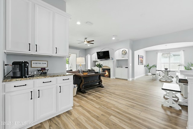 105 Weathered Oak Ct, Saint Johns, FL 32259 - kitchen with a ceiling fan, stone counters, white cabinetry, healthy amount of natural light, and recessed lighting