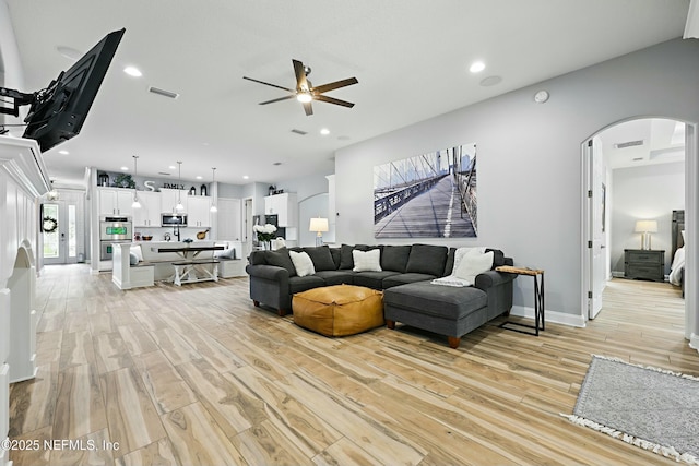 105 Weathered Oak Ct, Saint Johns, FL 32259 - living area with arched walkways, ceiling fan, light wood-type flooring, and recessed lighting