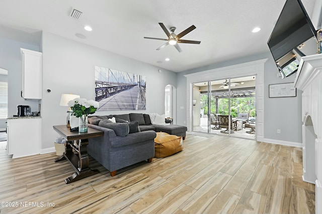 105 Weathered Oak Ct, Saint Johns, FL 32259 - living room with ceiling fan, arched walkways, light wood-style flooring, and recessed lighting