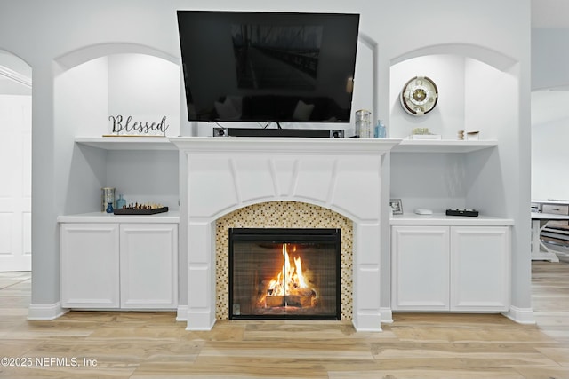 105 Weathered Oak Ct, Saint Johns, FL 32259 - detailed view of wood finished floors and a tiled fireplace
