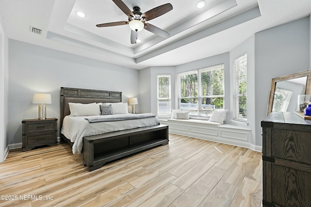 105 Weathered Oak Ct, Saint Johns, FL 32259 - bedroom with a tray ceiling, light wood-style flooring, recessed lighting, and a ceiling fan