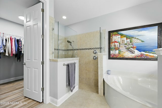 105 Weathered Oak Ct, Saint Johns, FL 32259 - full bath with a garden tub, walk in shower, a walk in closet, and tile patterned flooring