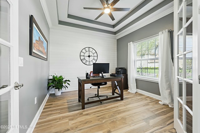 105 Weathered Oak Ct, Saint Johns, FL 32259 - home office featuring ceiling fan, light wood-style floors, a tray ceiling, wood walls, and ornamental molding