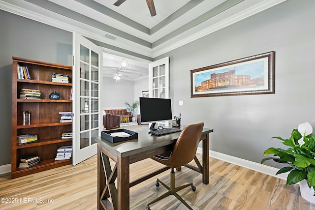 105 Weathered Oak Ct, Saint Johns, FL 32259 - home office featuring ceiling fan, ornamental molding, french doors, light wood-type flooring, and a tray ceiling