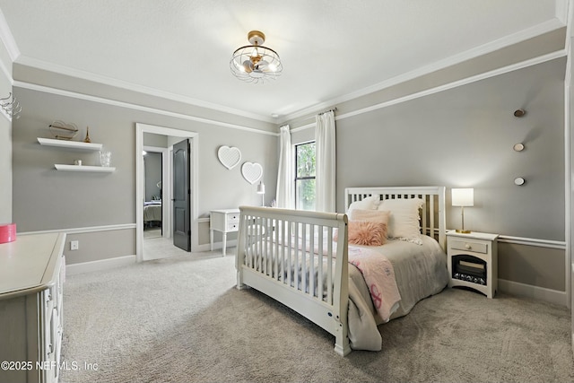 bedroom featuring carpet flooring, baseboards, and ornamental molding