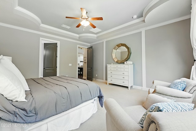 bedroom with baseboards, ornamental molding, visible vents, a raised ceiling, and carpet