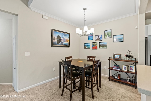 10075 N Gate Pkwy Unit 614, Jacksonville, FL 32246 - dining room featuring baseboards, a notable chandelier, light colored carpet, and ornamental molding