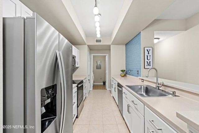10075 N Gate Pkwy Unit 614, Jacksonville, FL 32246 - kitchen featuring appliances with stainless steel finishes, a sink, white cabinetry, and visible vents