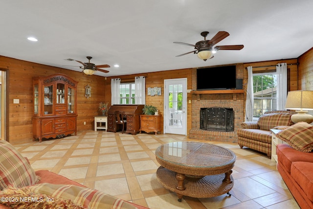 4864 County Road 218, Middleburg, FL 32068 - living room featuring recessed lighting, a fireplace, wooden walls, and ceiling fan