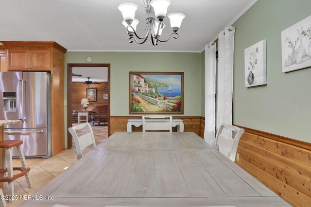 4864 County Road 218, Middleburg, FL 32068 - dining space with wooden walls, a notable chandelier, ornamental molding, and wainscoting