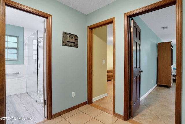 4864 County Road 218, Middleburg, FL 32068 - hall with visible vents, baseboards, and light tile patterned flooring
