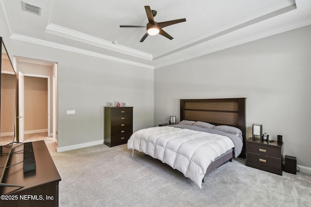 bedroom featuring visible vents, baseboards, a raised ceiling, and carpet floors