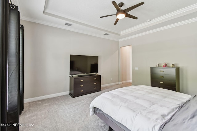bedroom featuring a tray ceiling, light colored carpet, baseboards, and visible vents