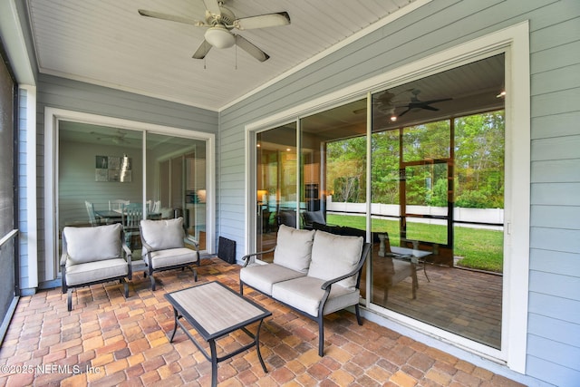 sunroom with an outdoor hangout area and ceiling fan