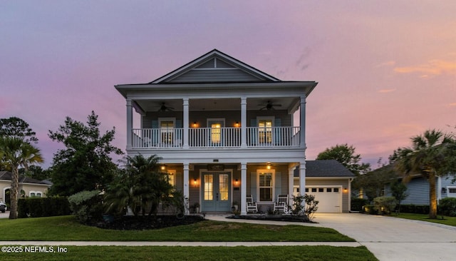 258 Haas Ave, Saint Augustine, FL 32095 - greek revival inspired property featuring a balcony, french doors, a porch, ceiling fan, and concrete driveway