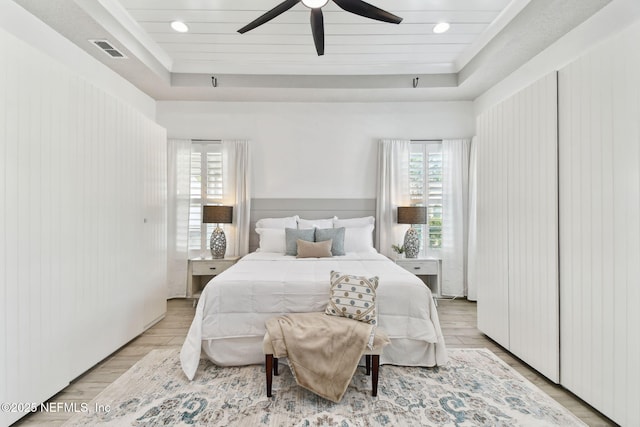 258 Haas Ave, Saint Augustine, FL 32095 - bedroom with a raised ceiling, light wood finished floors, ceiling fan, and recessed lighting