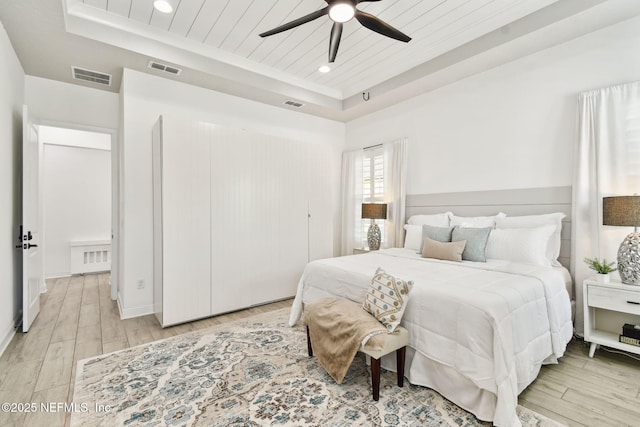 258 Haas Ave, Saint Augustine, FL 32095 - bedroom featuring a tray ceiling, light wood finished floors, wooden ceiling, ceiling fan, and recessed lighting