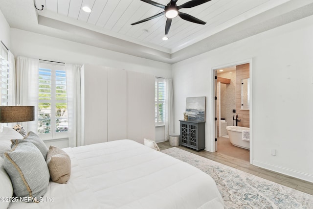 258 Haas Ave, Saint Augustine, FL 32095 - bedroom featuring a raised ceiling, multiple windows, wood finished floors, baseboards, and wooden ceiling