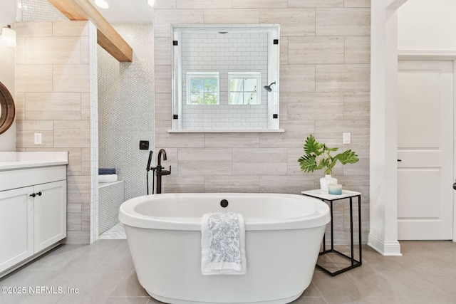 258 Haas Ave, Saint Augustine, FL 32095 - bathroom with tile walls, a freestanding bath, vanity, and tile patterned floors