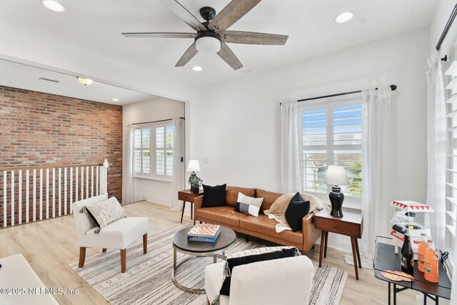 258 Haas Ave, Saint Augustine, FL 32095 - living room featuring a ceiling fan, brick wall, light wood-type flooring, and recessed lighting
