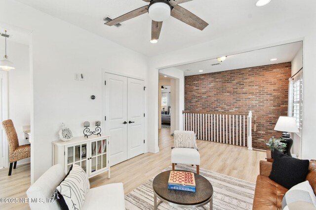 258 Haas Ave, Saint Augustine, FL 32095 - living area with brick wall, ceiling fan, light wood-type flooring, and recessed lighting