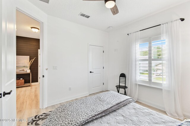 258 Haas Ave, Saint Augustine, FL 32095 - bedroom with light wood-style floors, a ceiling fan, and baseboards