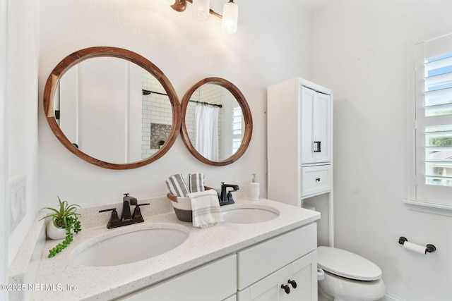 258 Haas Ave, Saint Augustine, FL 32095 - bathroom with double vanity, toilet, and a shower with shower curtain