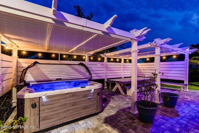 258 Haas Ave, Saint Augustine, FL 32095 - patio at twilight with a hot tub, a patio, and a pergola
