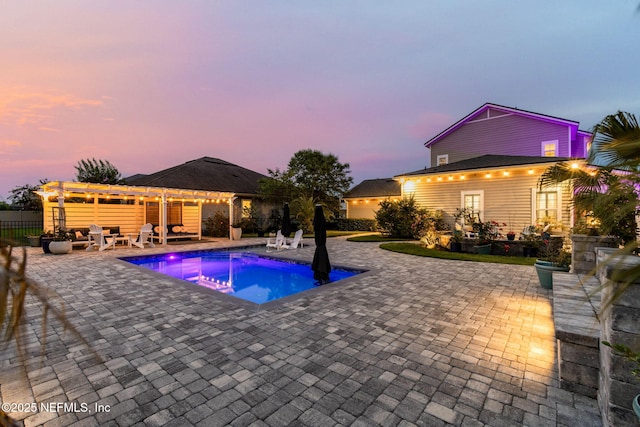 258 Haas Ave, Saint Augustine, FL 32095 - pool at dusk with a pergola and a patio area