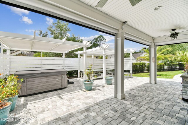 258 Haas Ave, Saint Augustine, FL 32095 - fenced backyard featuring a hot tub, a ceiling fan, a pergola, and a patio