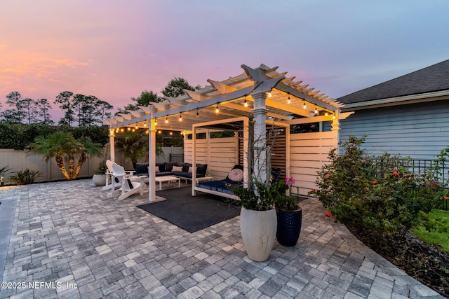 258 Haas Ave, Saint Augustine, FL 32095 - patio terrace at dusk featuring a pergola, an outdoor living space, a fenced backyard, and a patio area