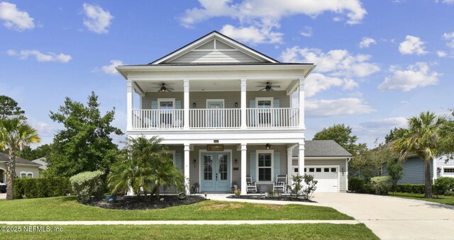 258 Haas Ave, Saint Augustine, FL 32095 - view of front facade featuring a balcony, a ceiling fan, a porch, and a front lawn