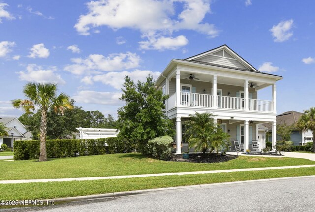 258 Haas Ave, Saint Augustine, FL 32095 - view of front of home featuring a ceiling fan, a balcony, covered porch, and a front yard