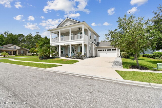 258 Haas Ave, Saint Augustine, FL 32095 - neoclassical / greek revival house with a balcony, driveway, a front yard, and a ceiling fan