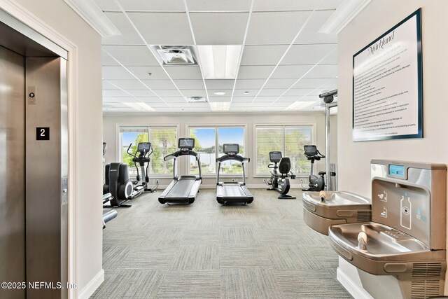 258 Haas Ave, Saint Augustine, FL 32095 - workout area with elevator, carpet floors, a paneled ceiling, and baseboards