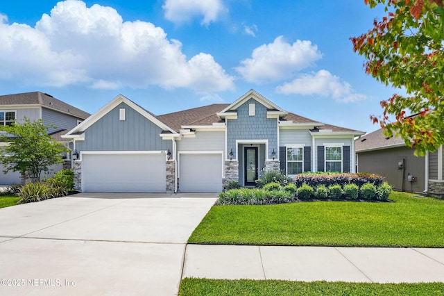 3313 Loofah Pl, Green Cove Springs, FL 32043 - craftsman inspired home featuring board and batten siding, stone siding, a front lawn, concrete driveway, and an attached garage