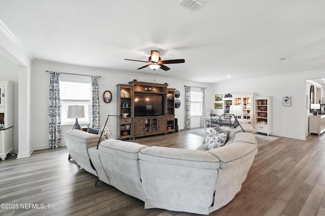 3313 Loofah Pl, Green Cove Springs, FL 32043 - living area with ornamental molding, a ceiling fan, visible vents, and wood finished floors