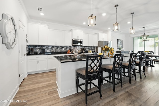 3313 Loofah Pl, Green Cove Springs, FL 32043 - kitchen featuring visible vents, stainless steel appliances, recessed lighting, and light wood-style floors