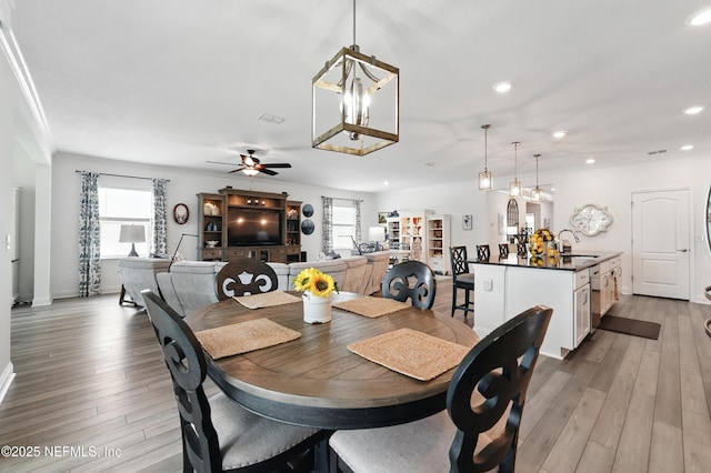 3313 Loofah Pl, Green Cove Springs, FL 32043 - dining area featuring recessed lighting, baseboards, light wood-style flooring, and ceiling fan with notable chandelier
