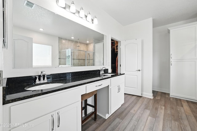 3313 Loofah Pl, Green Cove Springs, FL 32043 - full bath with double vanity, visible vents, a shower stall, and a sink