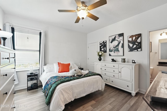 3313 Loofah Pl, Green Cove Springs, FL 32043 - bedroom featuring ceiling fan, wood finished floors, connected bathroom, and baseboards