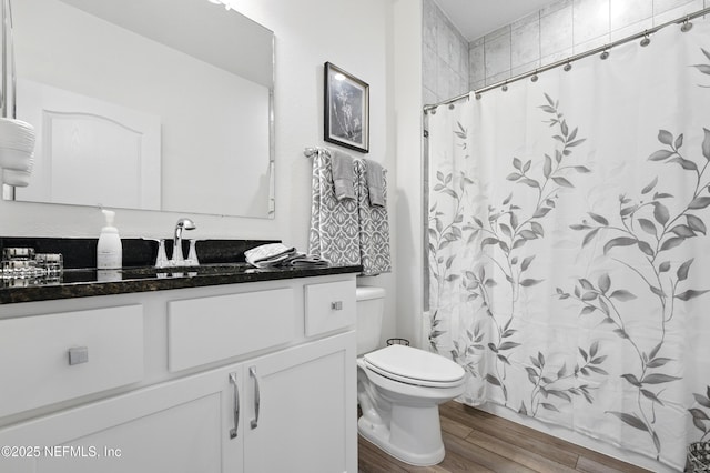 3313 Loofah Pl, Green Cove Springs, FL 32043 - full bath with toilet, wood finished floors, vanity, and a shower with shower curtain