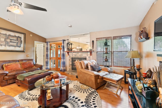 9083 Sable Ridge Ct, Jacksonville, FL 32244 - living room with a fireplace, ceiling fan, hardwood / wood-style flooring, and lofted ceiling