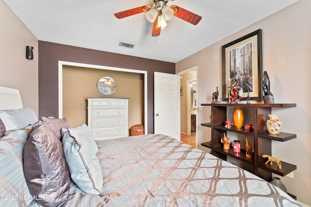 9083 Sable Ridge Ct, Jacksonville, FL 32244 - bedroom featuring visible vents, ceiling fan, and a textured ceiling