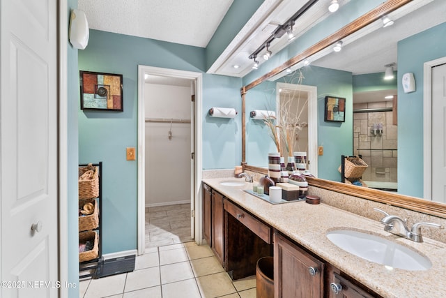 9083 Sable Ridge Ct, Jacksonville, FL 32244 - full bath with double vanity, a textured ceiling, a sink, and a stall shower