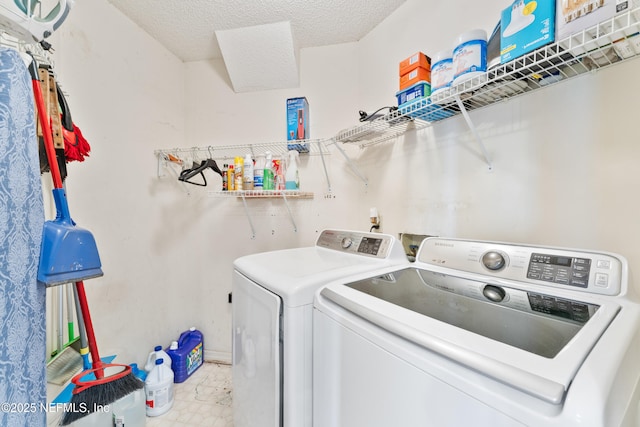9083 Sable Ridge Ct, Jacksonville, FL 32244 - clothes washing area featuring washing machine and dryer, laundry area, and a textured ceiling