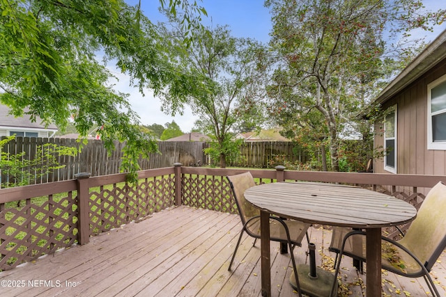 9083 Sable Ridge Ct, Jacksonville, FL 32244 - deck with outdoor dining area and a fenced backyard