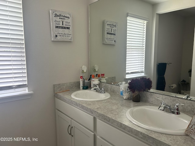 7133 Red Timber Rd, Jacksonville, FL 32244 - bathroom featuring healthy amount of natural light and double vanity